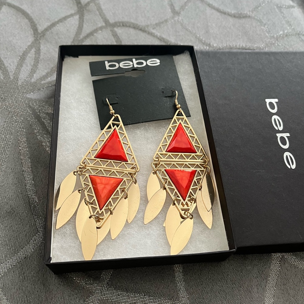 Bebe earrings. ‼️ BNWT ‼️ Gold tone with reddish orange faux stones.  BRAND NEW